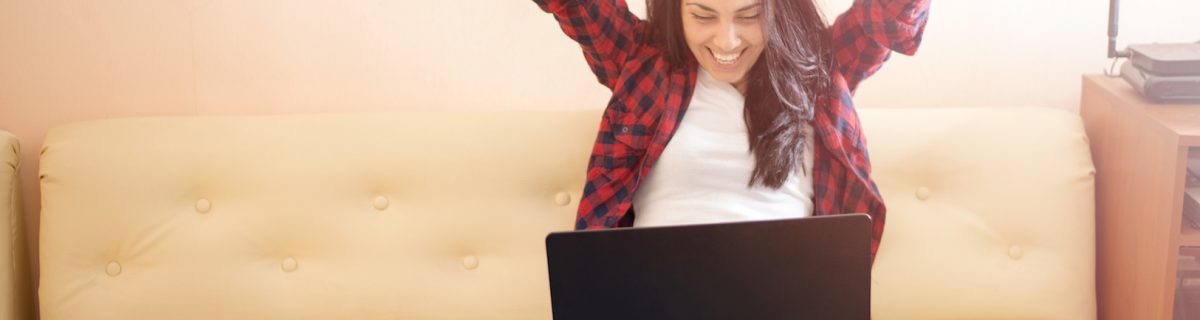 Happy woman with laptop ,excited face expression