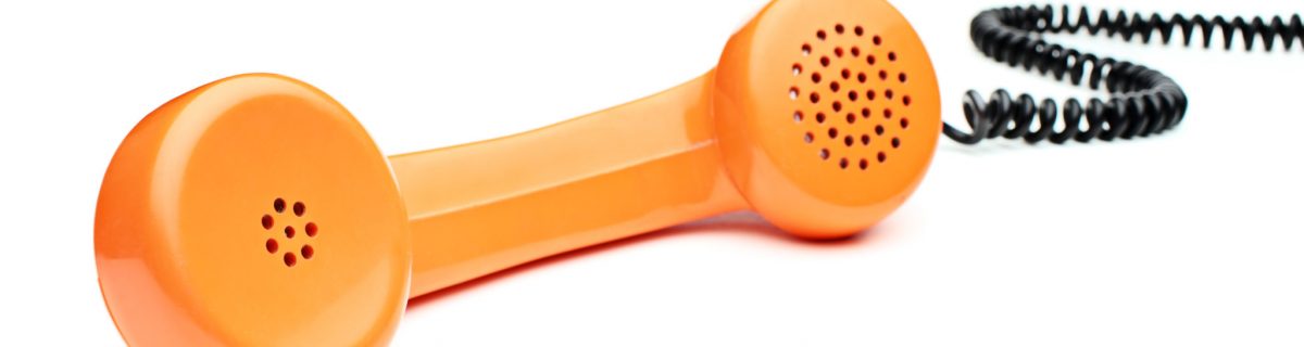 Orange phone receiver with cord